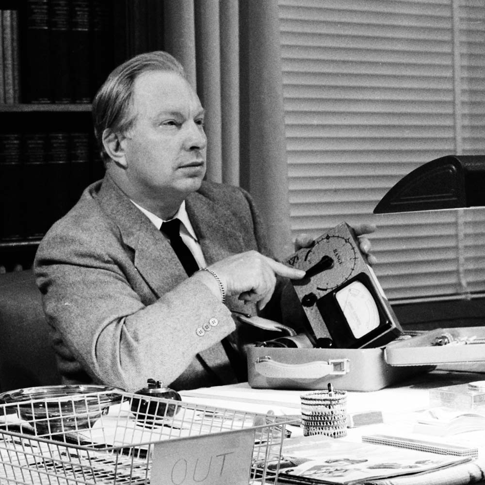 L. Ron Hubbard demonstrates his invention the E-Meter. 