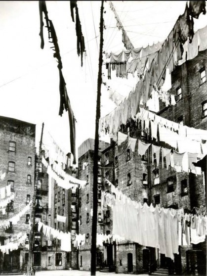 Clothes lines in a tenement backyard