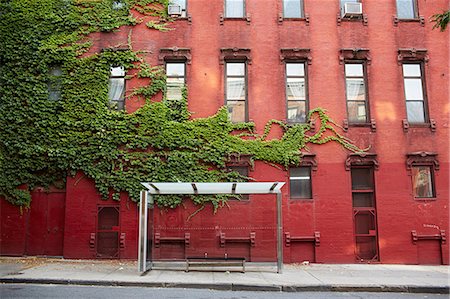 Empty bench at bus stop. 