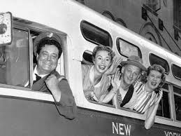 The cast of The Honeymooners on a bus. 