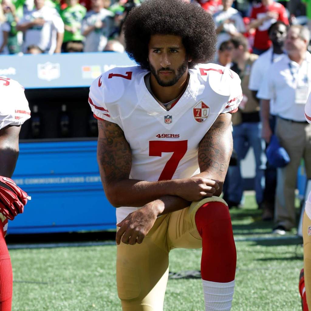 Colin Kapernick kneeling. 