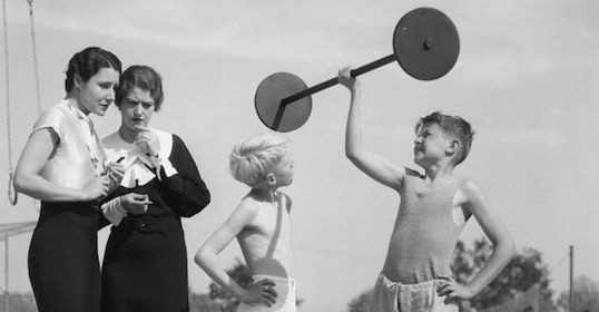 Vintage photo - young boys lifting barbell