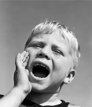 Vintage photo of young boy yelling 